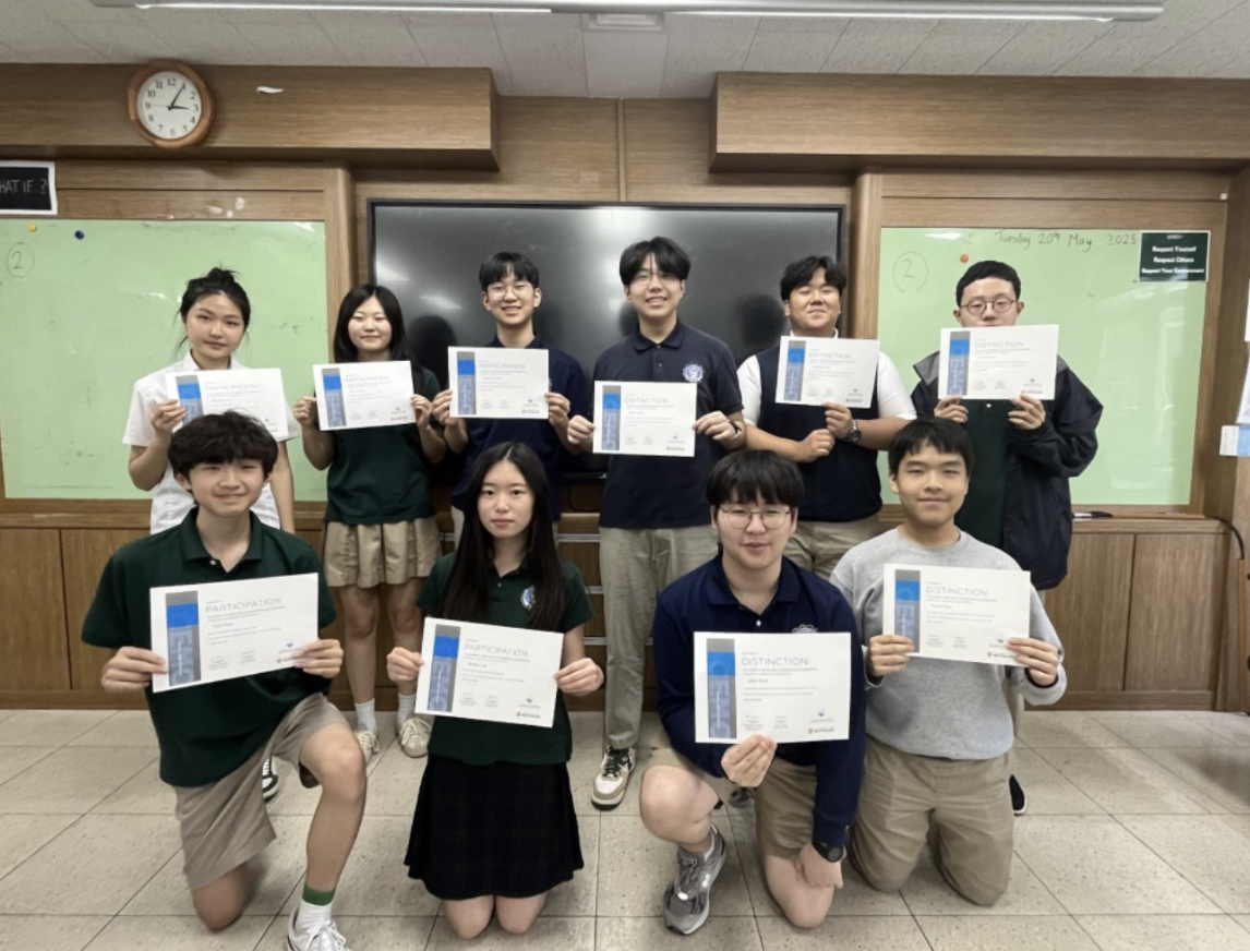 Computer Science Competition Club students displaying certificates